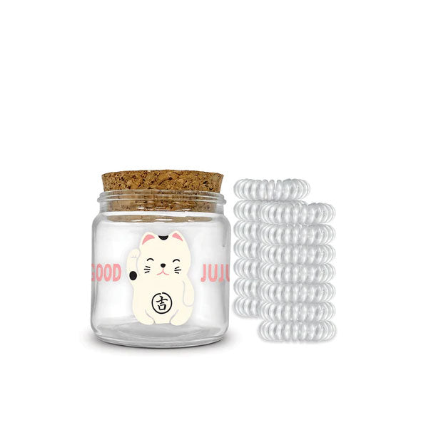 Cork-lidded jar with "Good Juju" lucky cat illustration is paired with 12 clear spiral hair ties