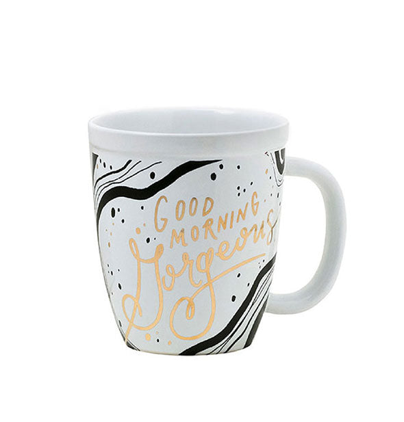 White coffee mug with black design accents and metallic gold foil lettering that says, "Good morning gorgeous"