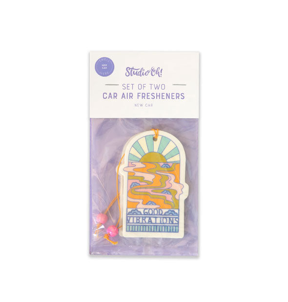 Pack of 2 car air fresheners by Studio Oh! feature a retro-style setting sun and water design above the words, "Good Vibrations"