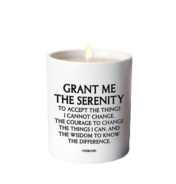 Lit candle in white vessel printed with this Niebuhr quote: "Grant me the serenity to accept the things I cannot change, the courage to change the things I can, and the wisdom to know the difference."