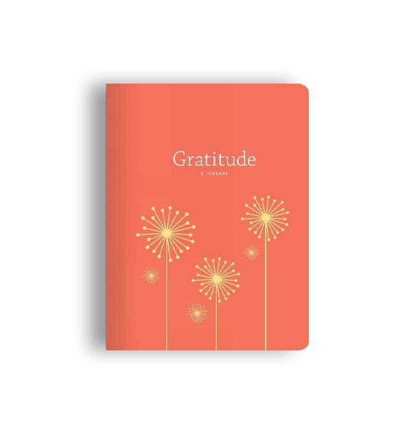 Coral-colored Gratitude: A Journal cover with gold dandelion illustrations
