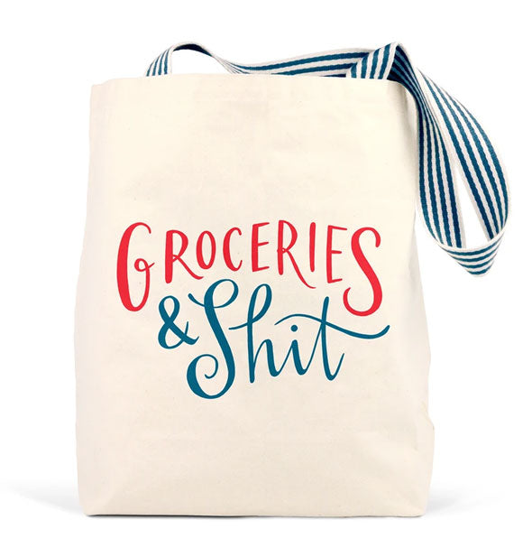 Cream-colored canvas tote bag with striped straps says, "Groceries & Shit" in blue and red lettering