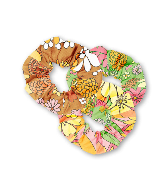 Set of three hair scrunchies each featuring a different retro-style floral pattern