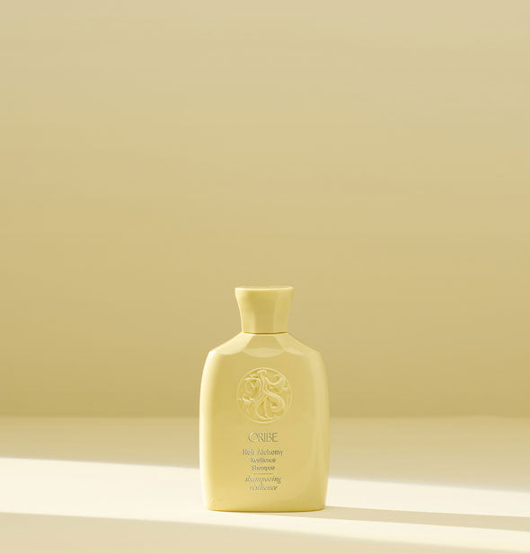 Travel size bottle of Oribe Hair Alchemy Resilience Shampoo