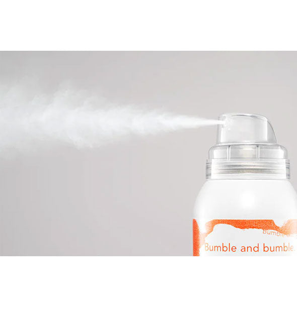 A fine mist is dispensed from a can of Bumble and bumble Hairdresser's Invisible Oil Dry Oil Finishing Spray