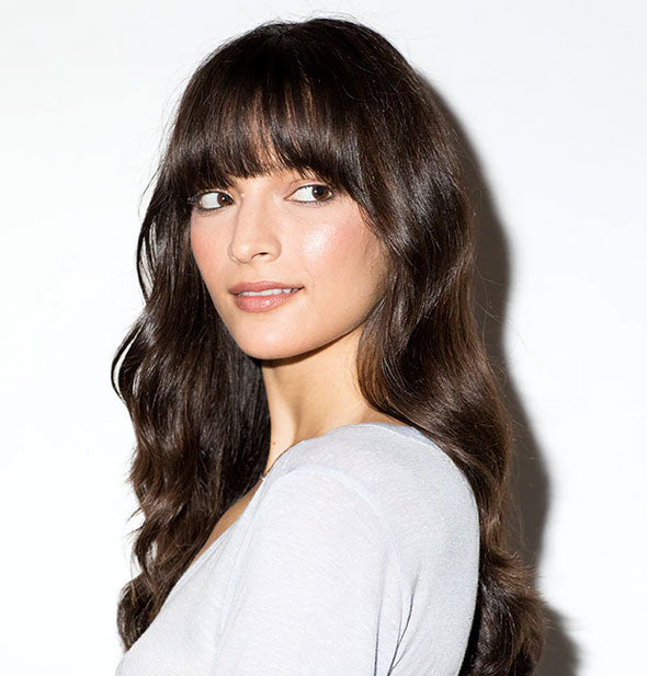Model with long, healthy-looking hair meant to demonstrate the result of using Bumble and bumble Hairdresser's Invisible Oil Shampoo