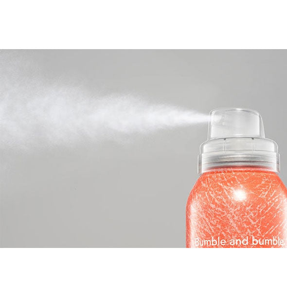 A fine mist is dispensed from a can of Bumble and bumble Hairdresser's Invisible Oil Soft Texture Finishing Spray