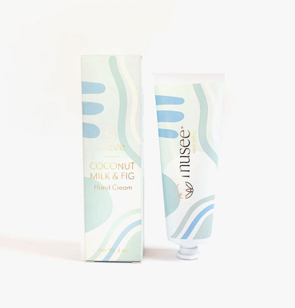 Tube and box of Musee Coconut Milk & Fig Hand Cream with blue, green, and white wavy pattern