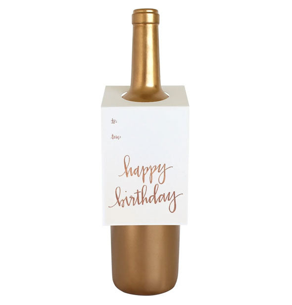 Gold wine bottle with white "Happy Birthday" gift tag hung around its neck