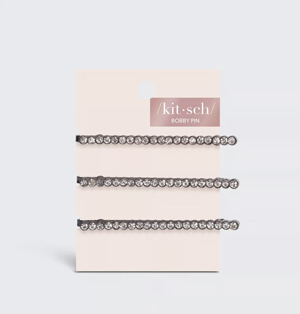 Pack of three hematite rhinestone-covered bobby pins on a light pink Kitsch product card
