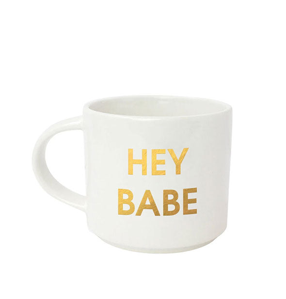 White coffee mug says, "Hey Babe" in metallic gold foil lettering