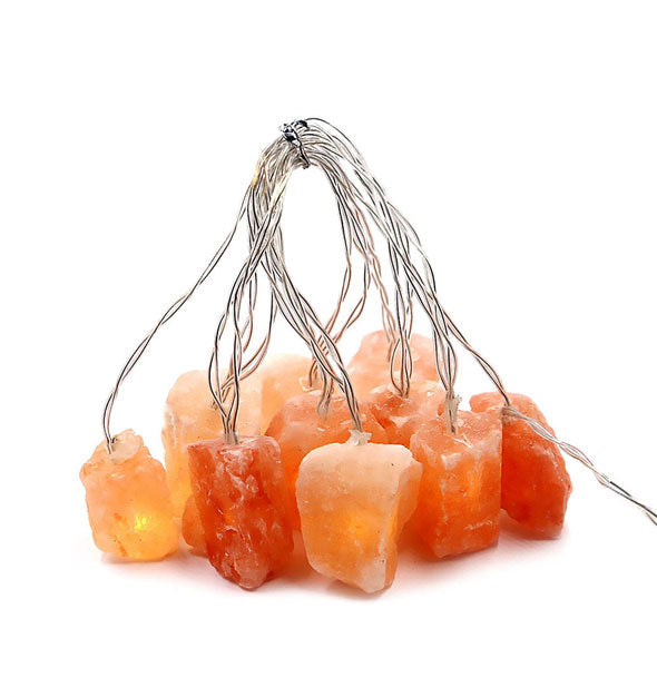 String of pink Himalayan salt crystal lights gathered at the top with a tie