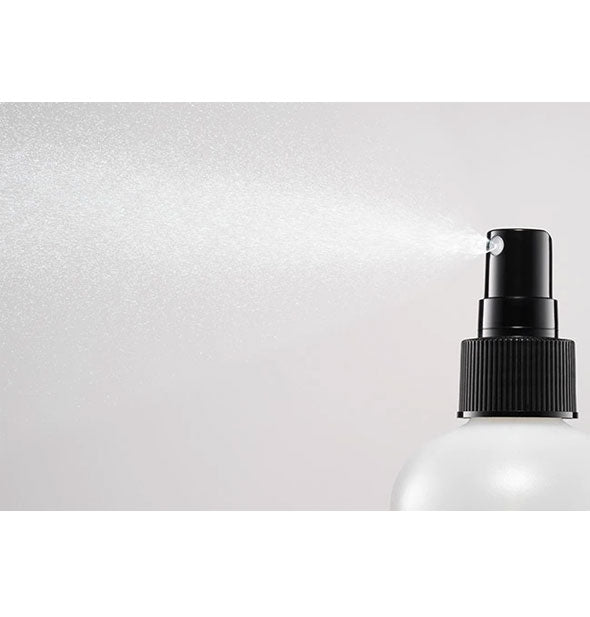 A fine mist is dispensed from a bottle of Bumble and bumble Holding Spray