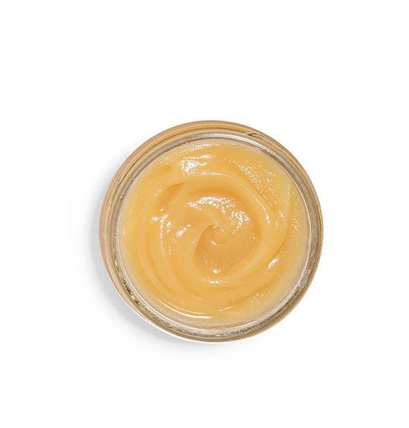Top view of a jar of Sunflower Honey-Butter moisturizer has the appearance of raw honey