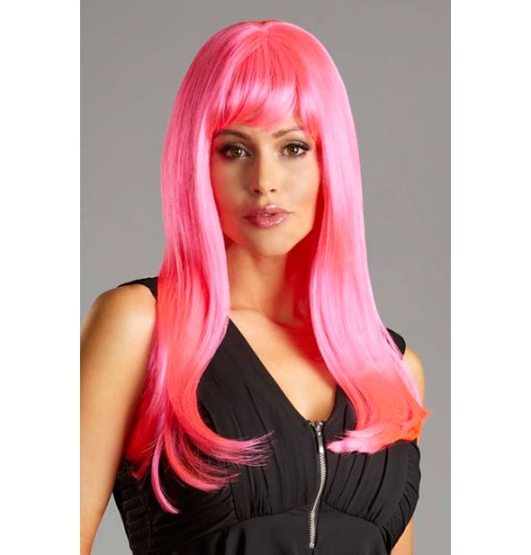 Model wearing a long, pink wig with bangs.