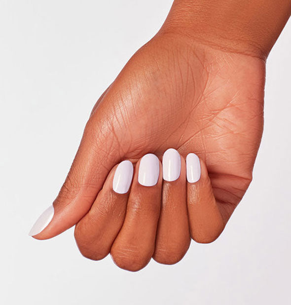 Model's hand wears an almost-white shade of pastel purple nail polish