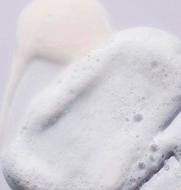 Closeup of Pureology Hydrate Sheer Shampoo lather shows color and consistency