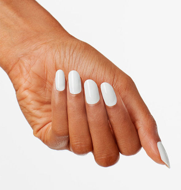 Model's hand wears a grayish-white shade of nail polish