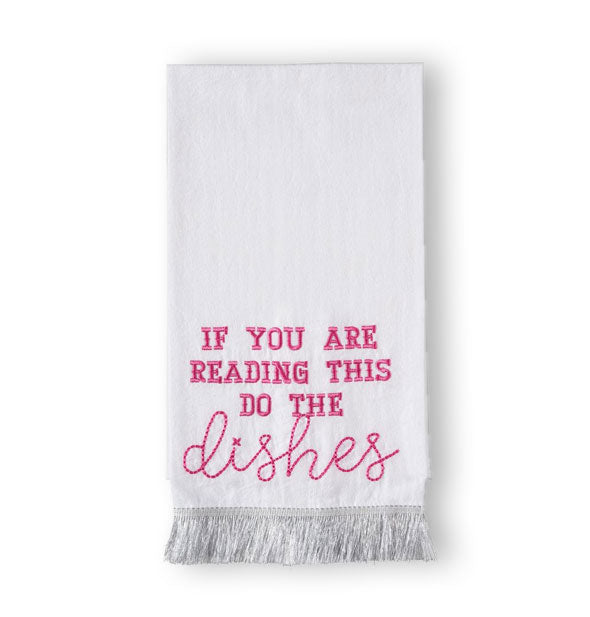 Folded white dish towel with silver fringe at the bottom says, "If you are reading this do the dishes" in hot pink embroidered lettering