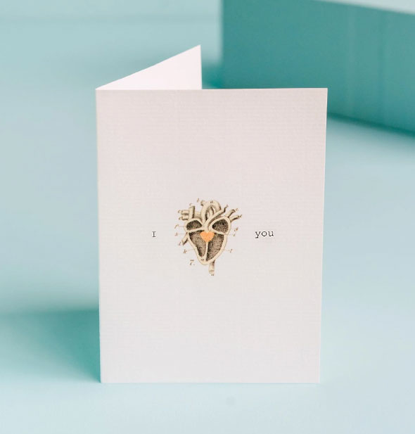 Greeting card to say "I love you" features a vintage heart diagram where the word love would be