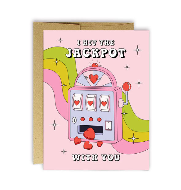 Pink greeting card with kraft envelope features a heart-themed slot machine with the words, "I hit the jackpot with you"