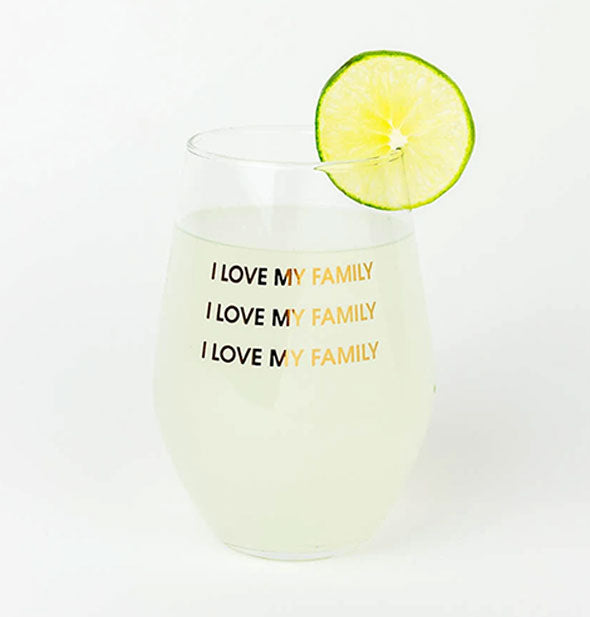 I Love My Family Stemless Wine Glass staged with a beverage inside and lime garnish on the rim.