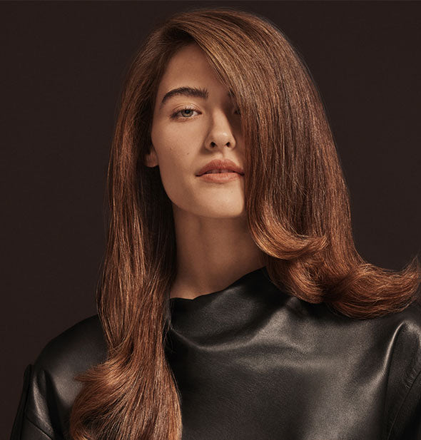 Voluminous hair styled with Oribe Imperial Blowout Transformative Styling Crème
