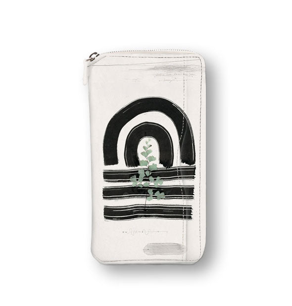 White rectangular wallet with bold black brushstroke design and pressed leaf accent