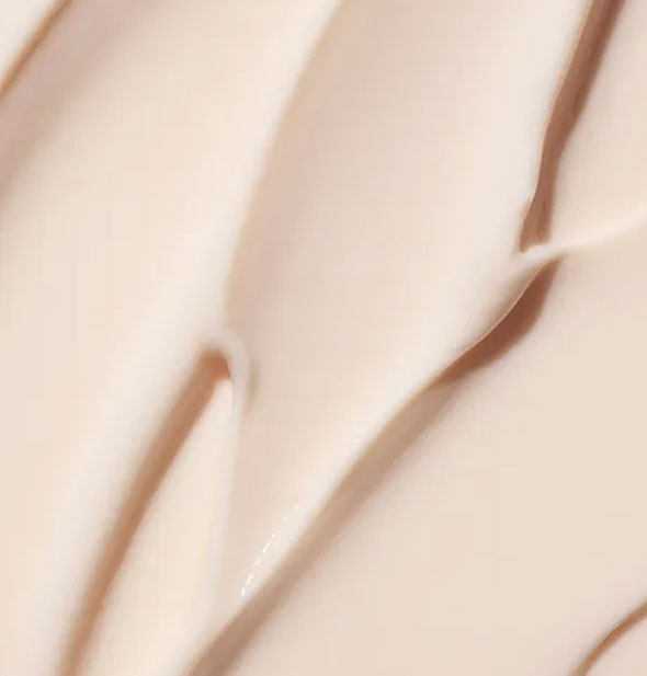 Closeup of a Moroccanoil Intense Curl Cream application shows product color and consistency