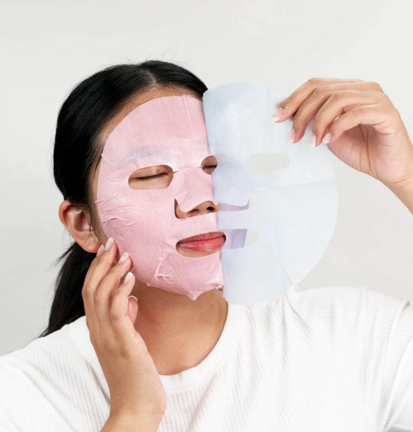 Model applies a pink sheet mask to face and pulls away the protective film