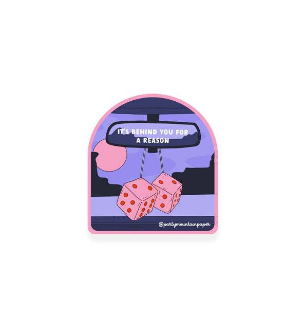 Pink and purple sticker with arced shape features illustration of a car rear view mirror that says, "It's behind you for a reason" with pink dice hanging below
