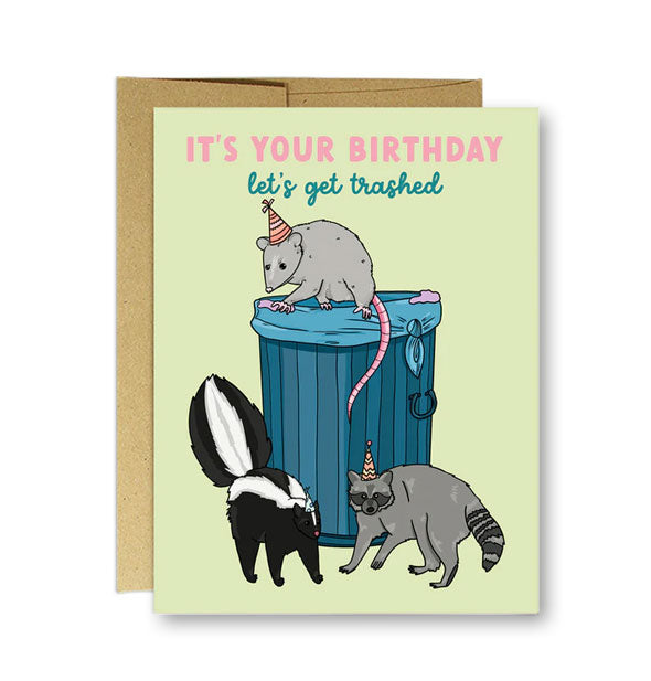 Light green greeting card with illustration of an opossum, skunk, and raccoon in party hats gathered around a trashcan says, "It's your birthday, let's get trashed"