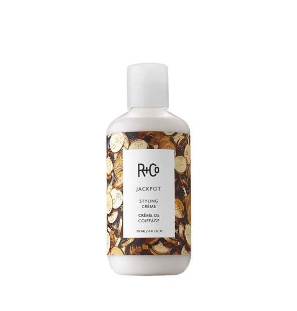 6 ounce bottle of R+Co Jackpot Styling Crème with gold token design