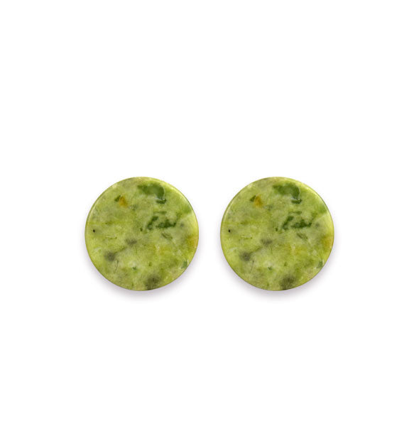 Two flat, round jade stones