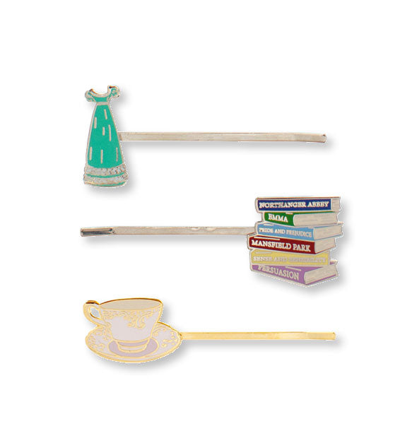 Three hairpins with enamel dress, stack of Jane Austen novels, and teacup decorations