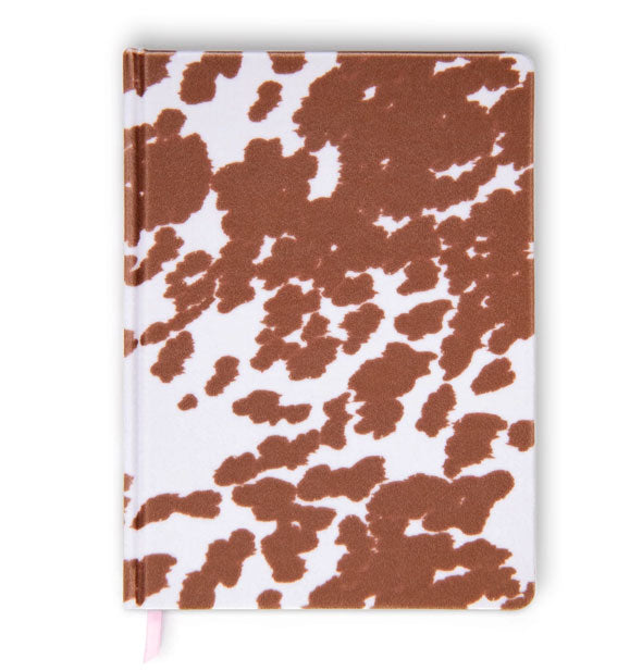 Journal cover features a brown and white cowhide print; a pink ribbon bookmark extends partially from the bottom