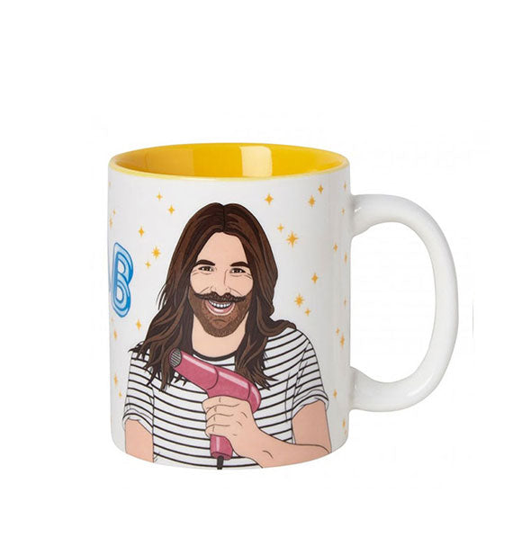 White coffee mug with yellow interior features illustration of Jonathan Van Ness from Queer Eye holding a pink hair dryer
