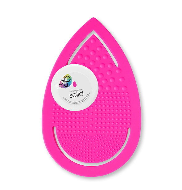 Textured pink teardrop-shaped pad with Solid cleansing disc