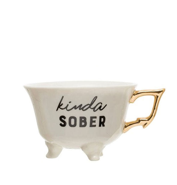 Footed teacup with gold handle says, "Kinda Sober"