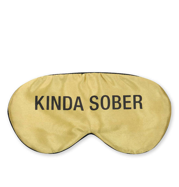 Gold eye mask says, "Kinda sober" in black lettering