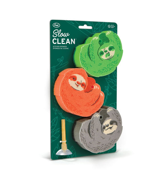 Green, orange, and gray Slow Clean sloth dish sponges with wooden peg and suction cup on a product card