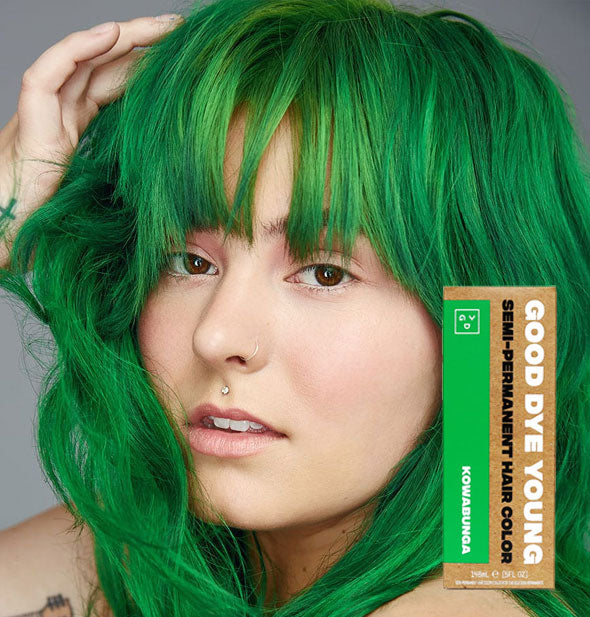 Model with bright green hair color by Good Dye Young in the shade Kowabunga