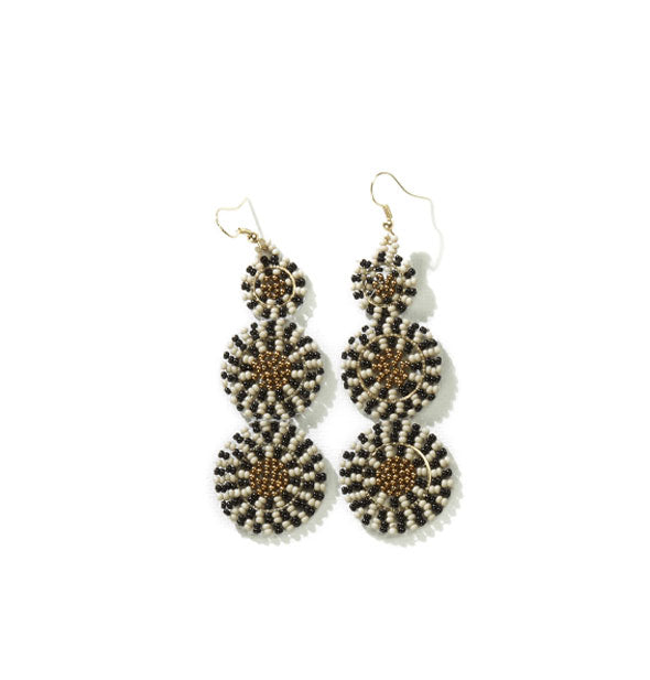 Pair of earrings featuring a triple beaded circle design in earth tones