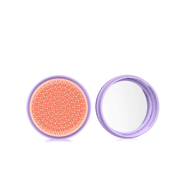 Round lavender and peach macaron-shaped hairbrush shown open to reveal compact mirror inside