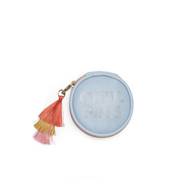 Round blue pill case with tricolor tassel zipper pull says, "Chill Pills" in metallic lettering