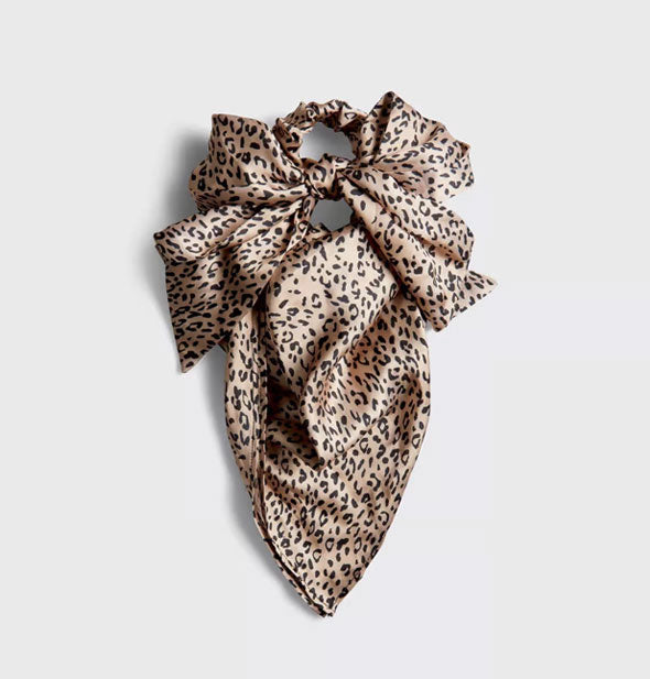Brown and black leopard print satin hair scarf with ruched band and ties tied in a bow