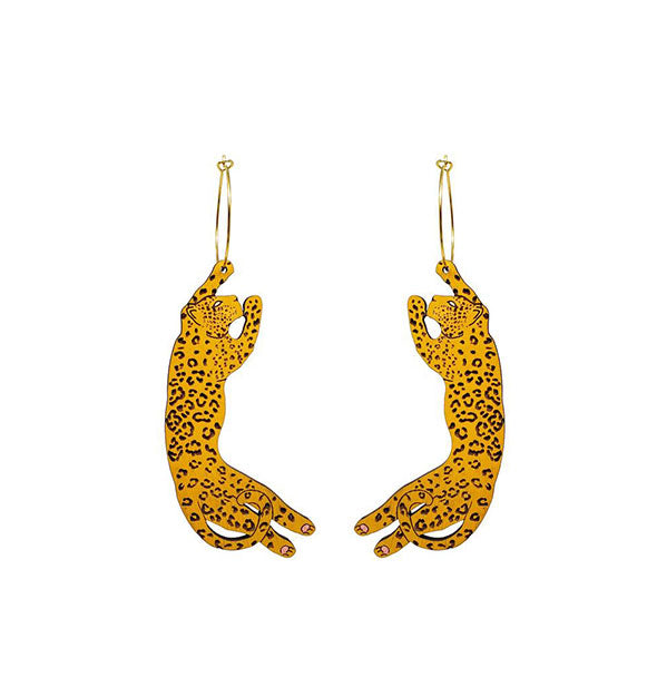 Pair of black and gold carved leopard earrings on gold hoops