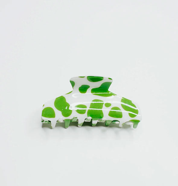 White claw clip with lime green cow print spots