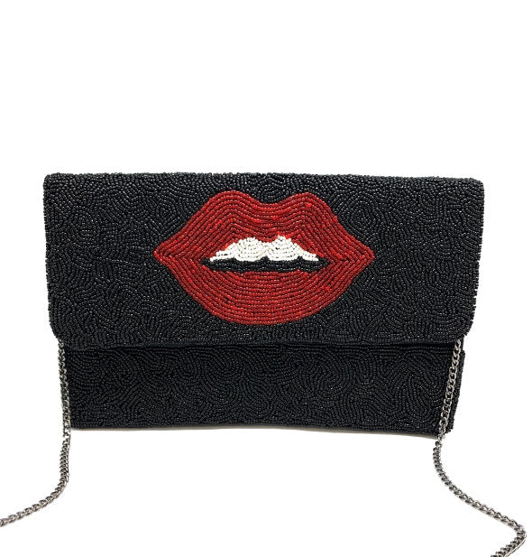 Rectangular black beaded bag with central red lips design and silver chain strap