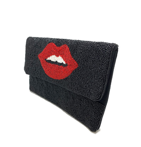 Rectangular black beaded bag with central red lips design